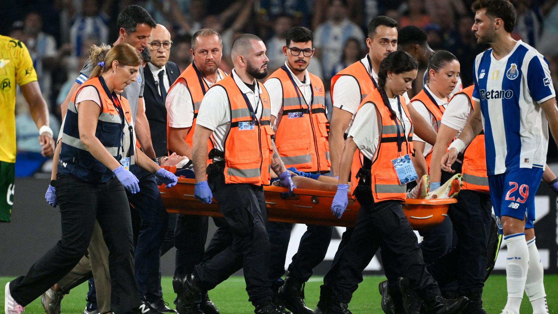 Arsenal and Man Utd transfer target, 20, rushed to hospital after being knocked unconscious and stretchered off pitch