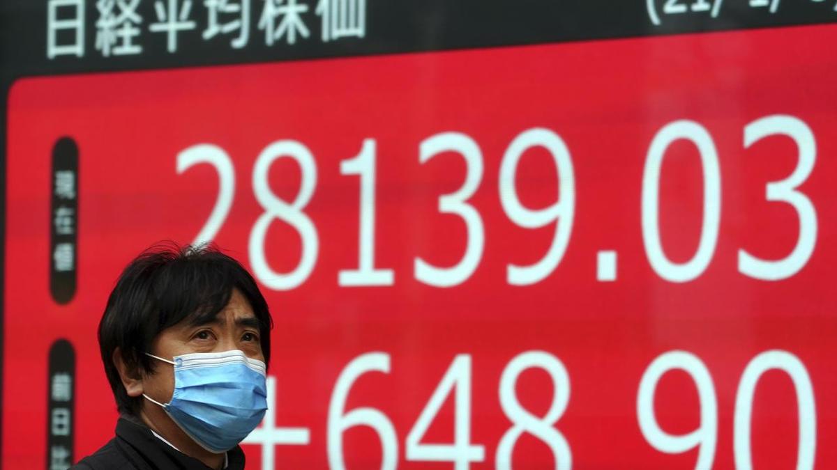 Asia stocks waver as yen surges, Iran issues warning
