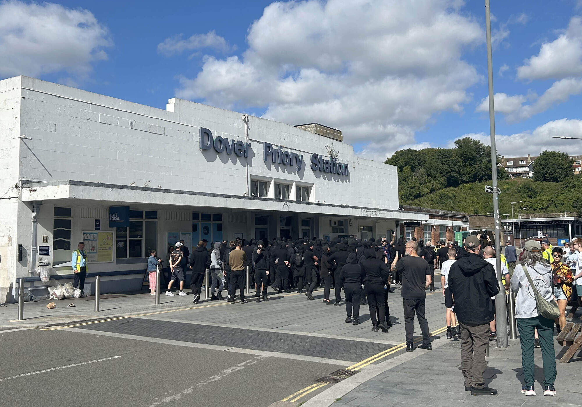 Black-clad masked ‘stop the boats’ protesters block roads in Dover