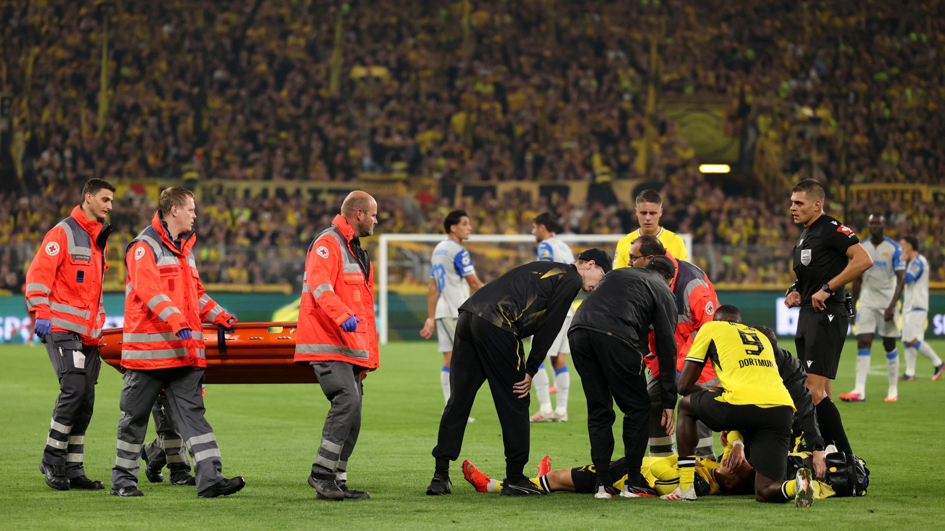 Borussia Dortmund star, 18, stretchered off pitch and rushed to hospital after worrying scenes in Champions League