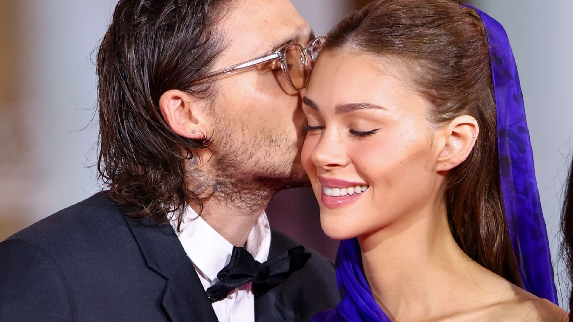 Brooklyn Beckham plays the doting husband to wife Nicola on the red carpet at Venice Film Festival as she picks up award