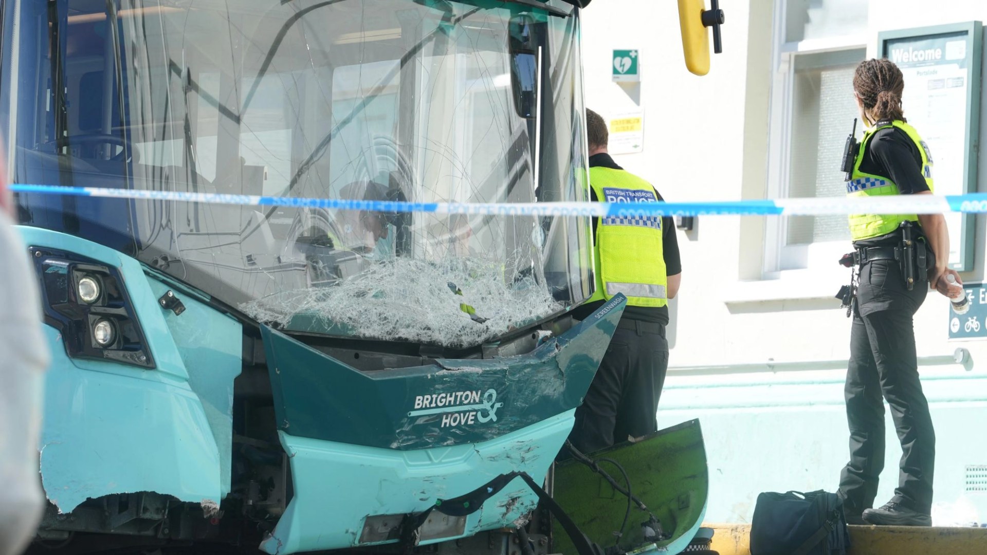 Bus ploughs into parked cars at UK train station with road closed & services cancelled