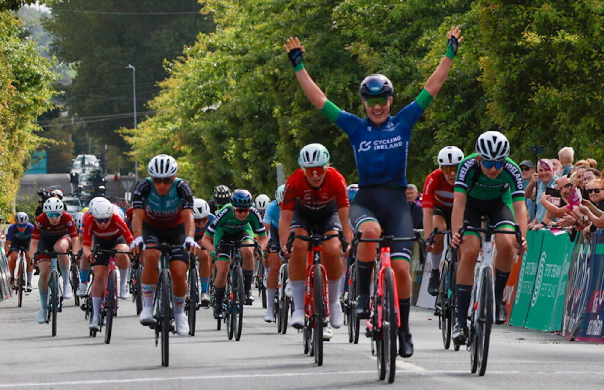 Crowds watch Rás na mBan cyclists cross the finish line of tough Wexford stage