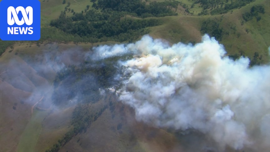 Dozens of bushfires burn as Qld swelters through above-average temps