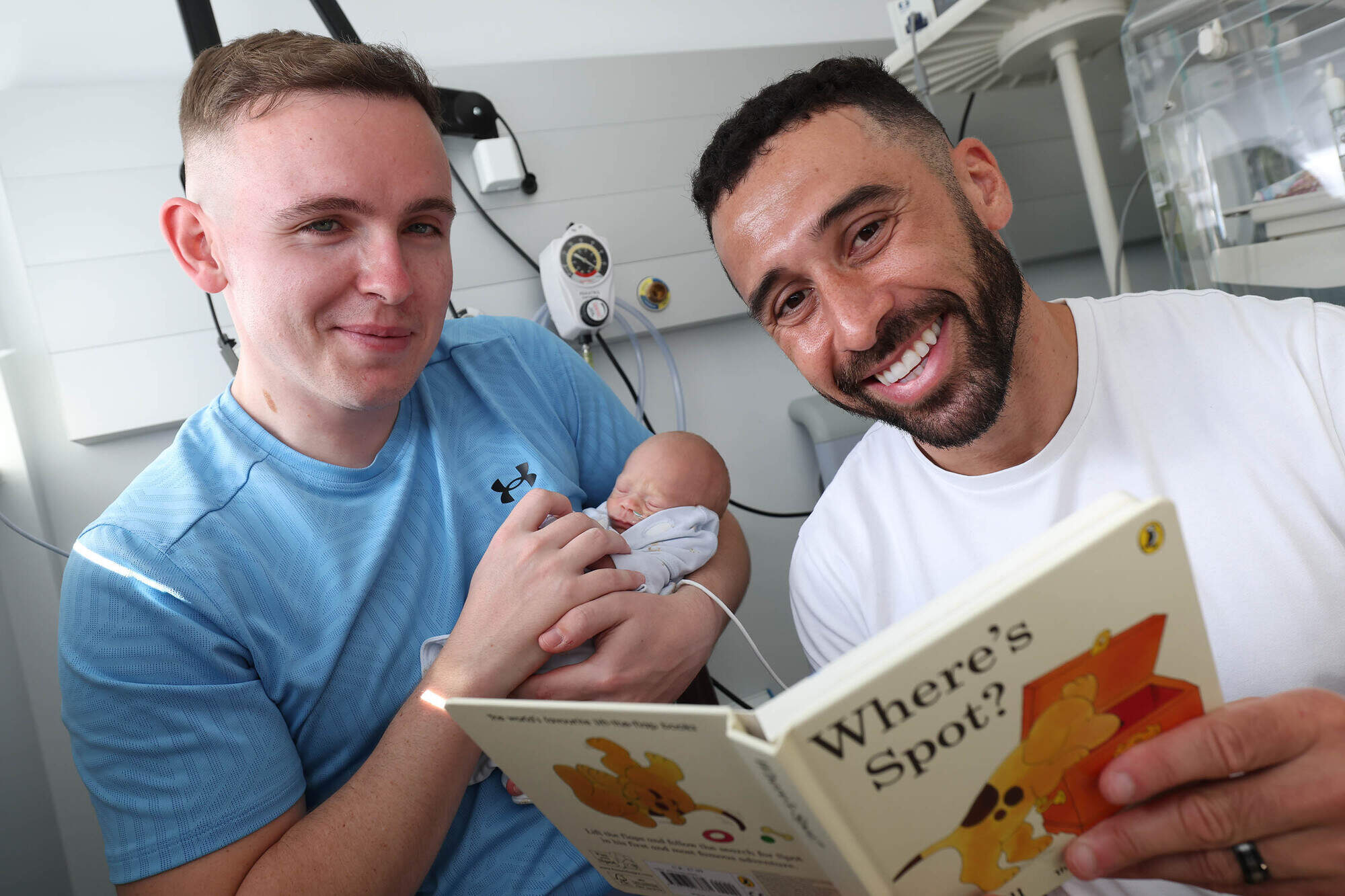 Footballer Pico Lopes reads to premature babies in the NICU at The Coombe Hospital