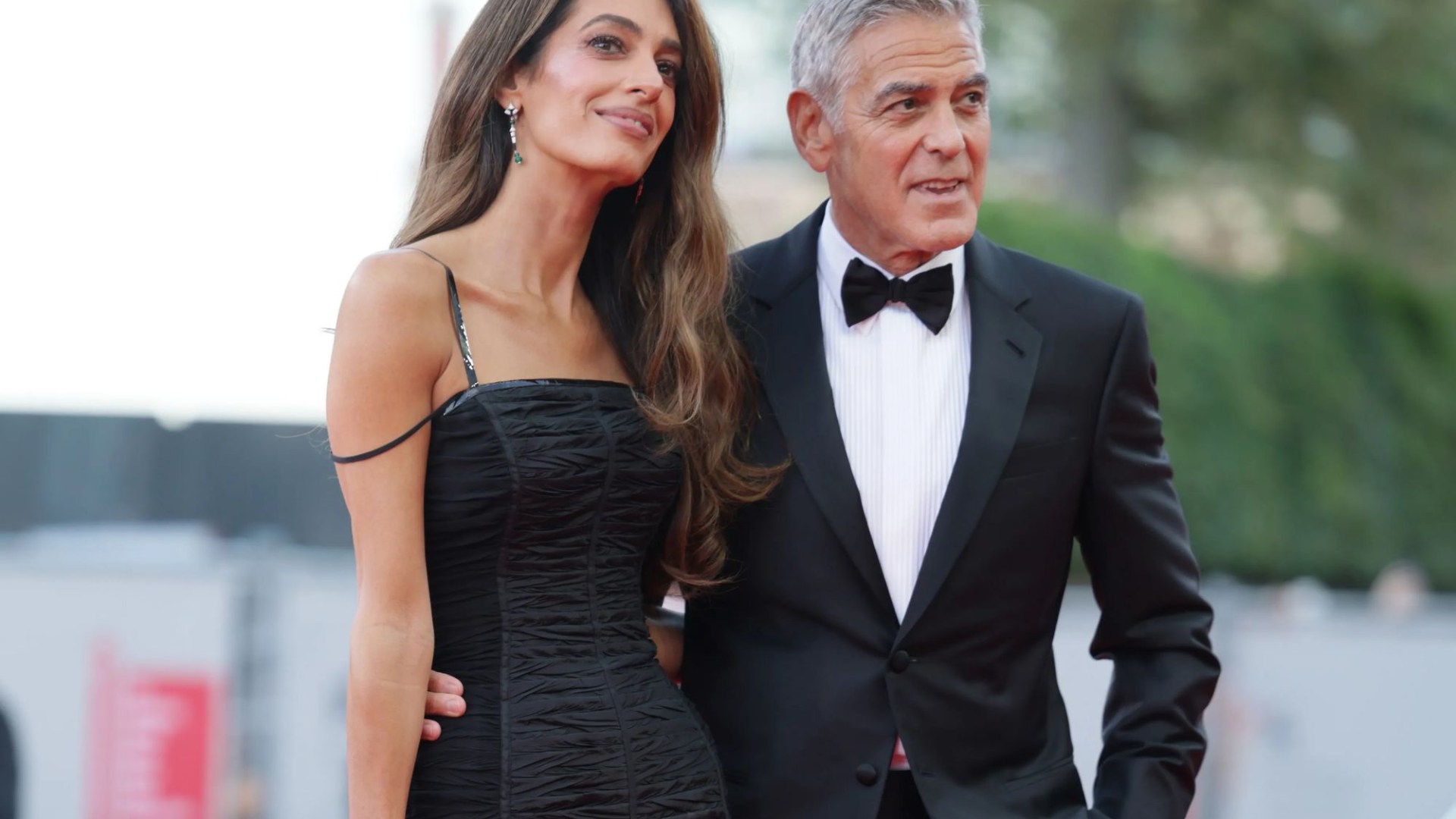 George Clooney and wife Amal dazzle on the red carpet at star-studded premiere of film about rise of The Sun