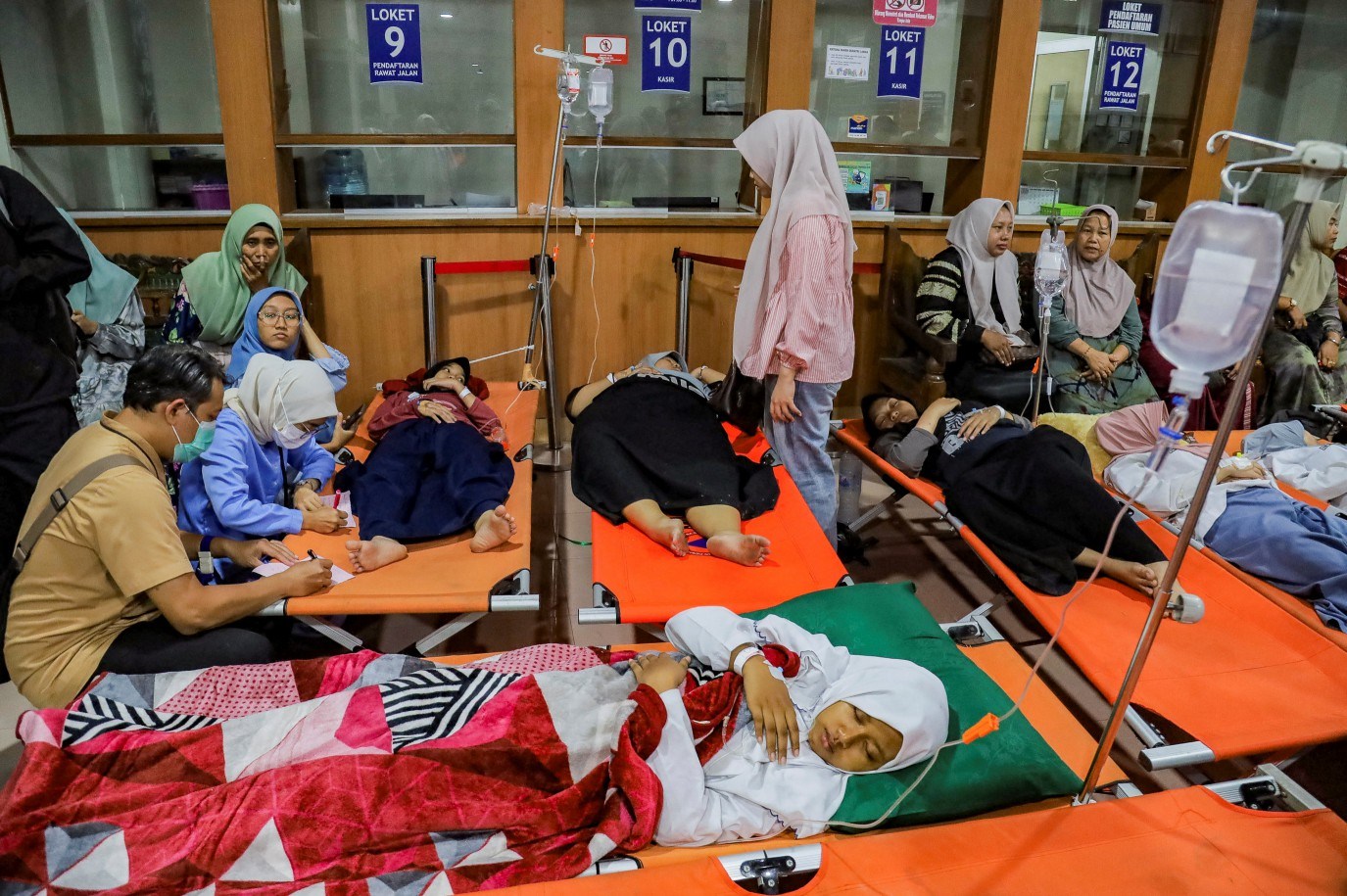 Government sparks mass food poisoning outbreak as more than 800 students and teachers fall sick after eating free meals