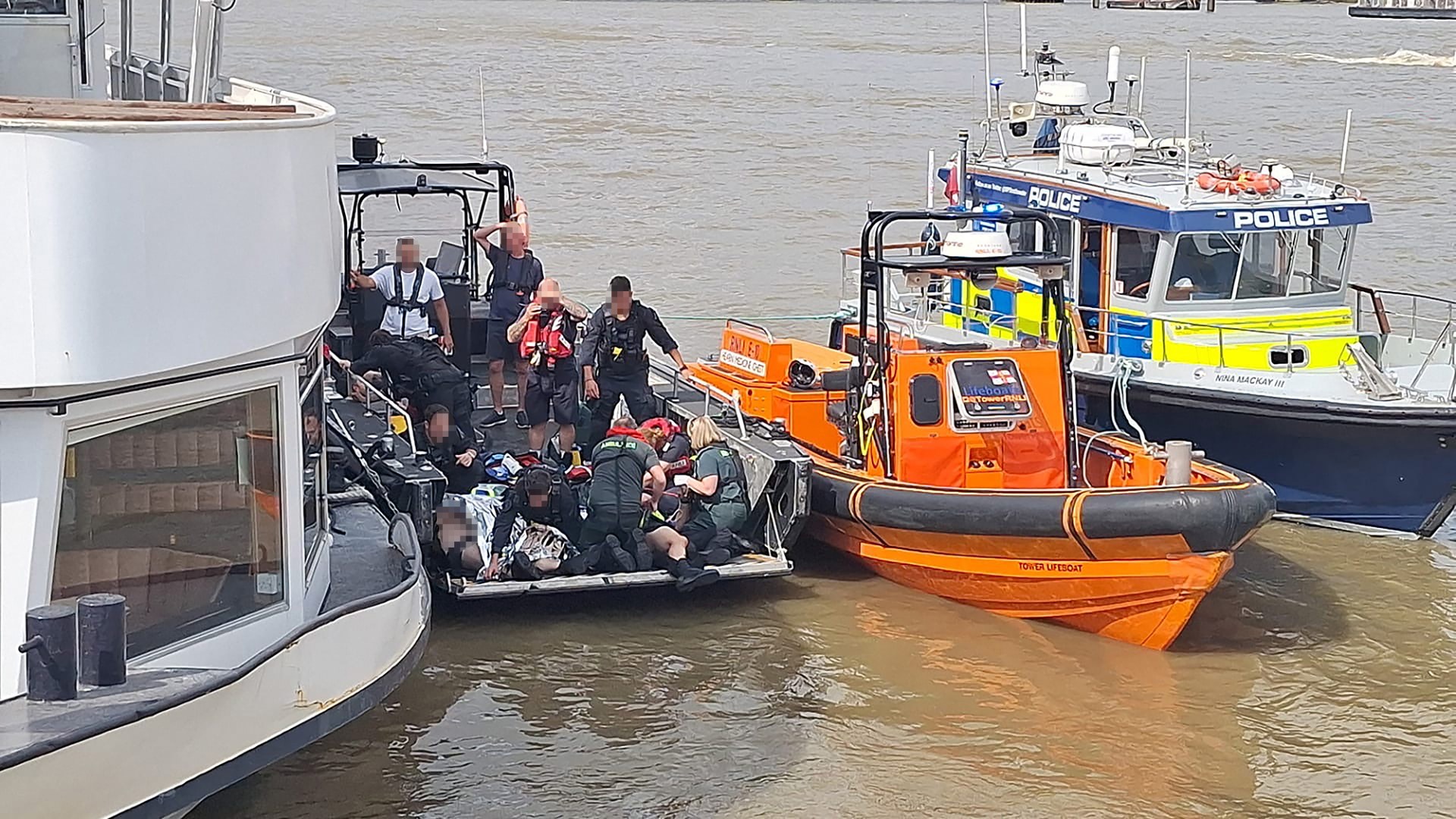 Hero cop swims through Thames in full kit to save unconscious colleague after police boat crash