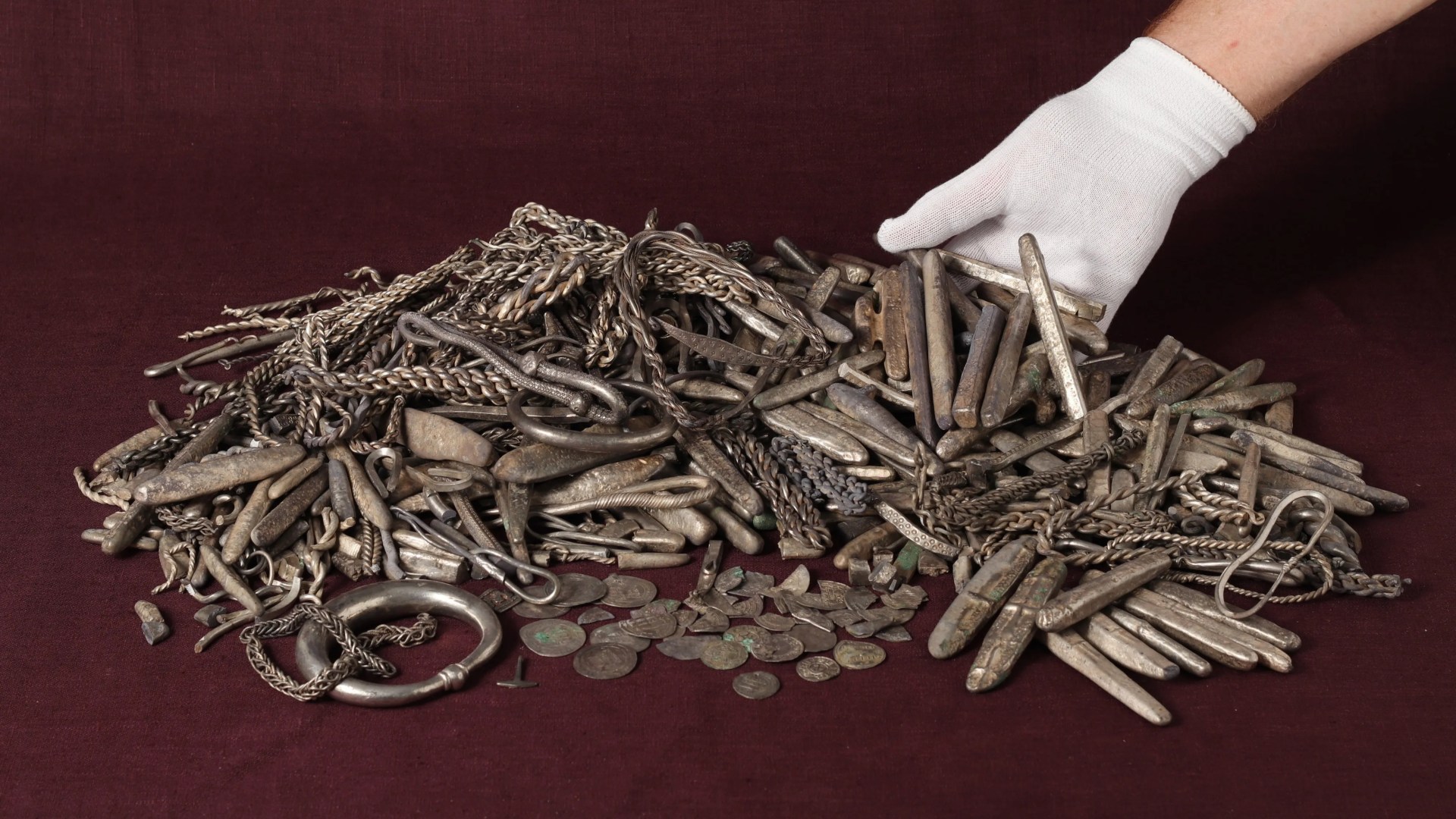 Homeowner finds Denmark’s largest Viking silver hoard while digging up his garden – including mini Thor’s hammer