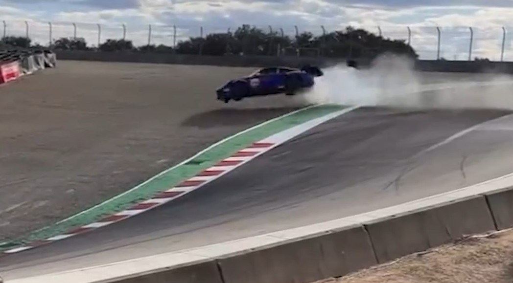 Horrifying moment Porsche race car driver flies off track and smashes into barrier in dramatic high-speed crash