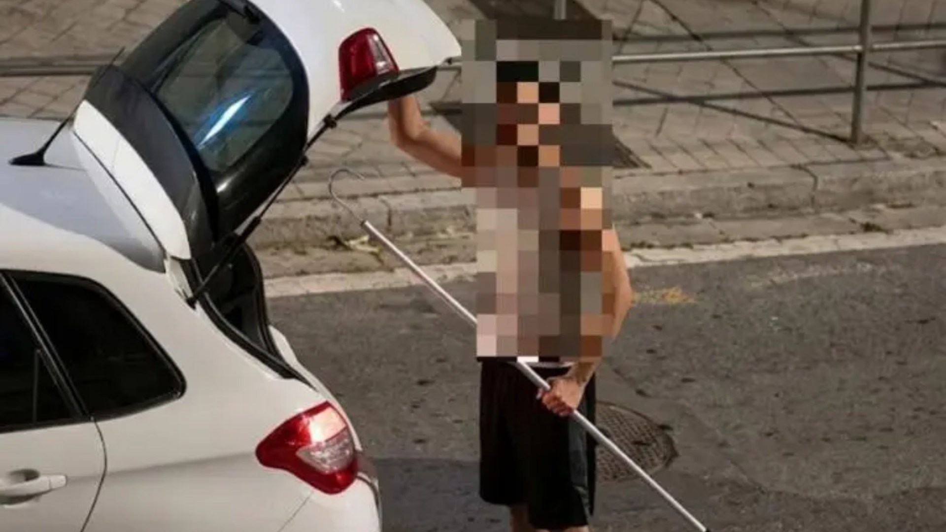Horrifying moment driver attacks pedestrian with HARPOON before hooking him to metal railing in road rage confrontation