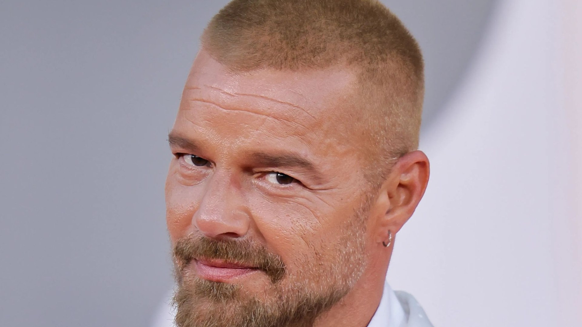 Huge 90s pop star looks unrecognisable as he hits red carpet with buzz cut 27 years after smash hit – can you guess who?