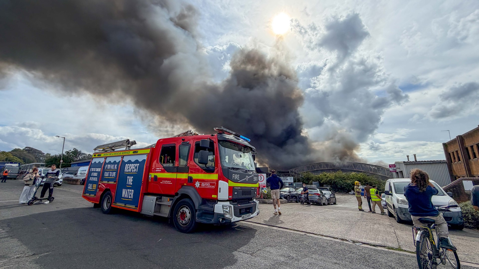 Huge fire erupts near homes as smoke billows for miles & residents warned to close windows after ‘explosions’ heard
