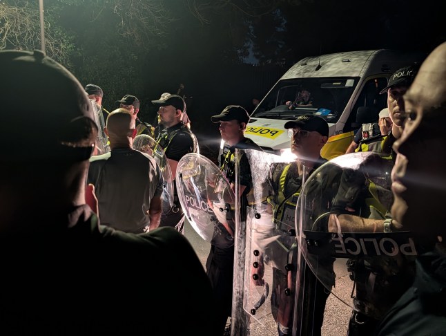 Hundreds of masked men block coach of migrants in Portsmouth