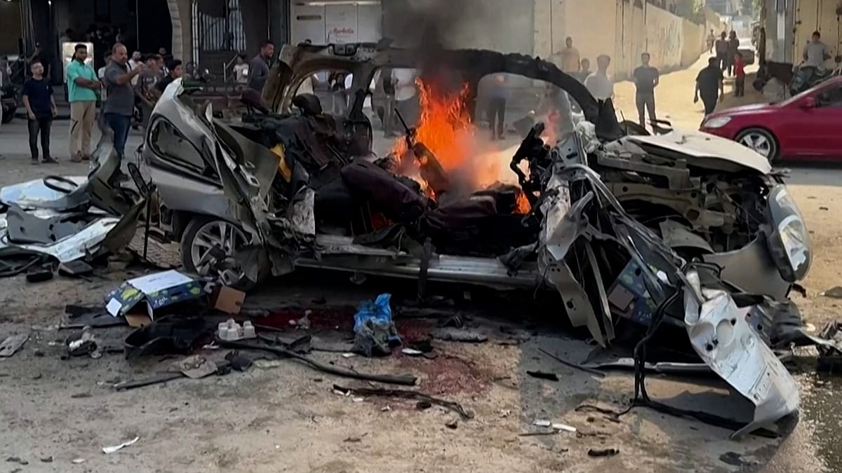 Israeli strike on Gaza vehicle kills two Hamas engineers, 13 wounded