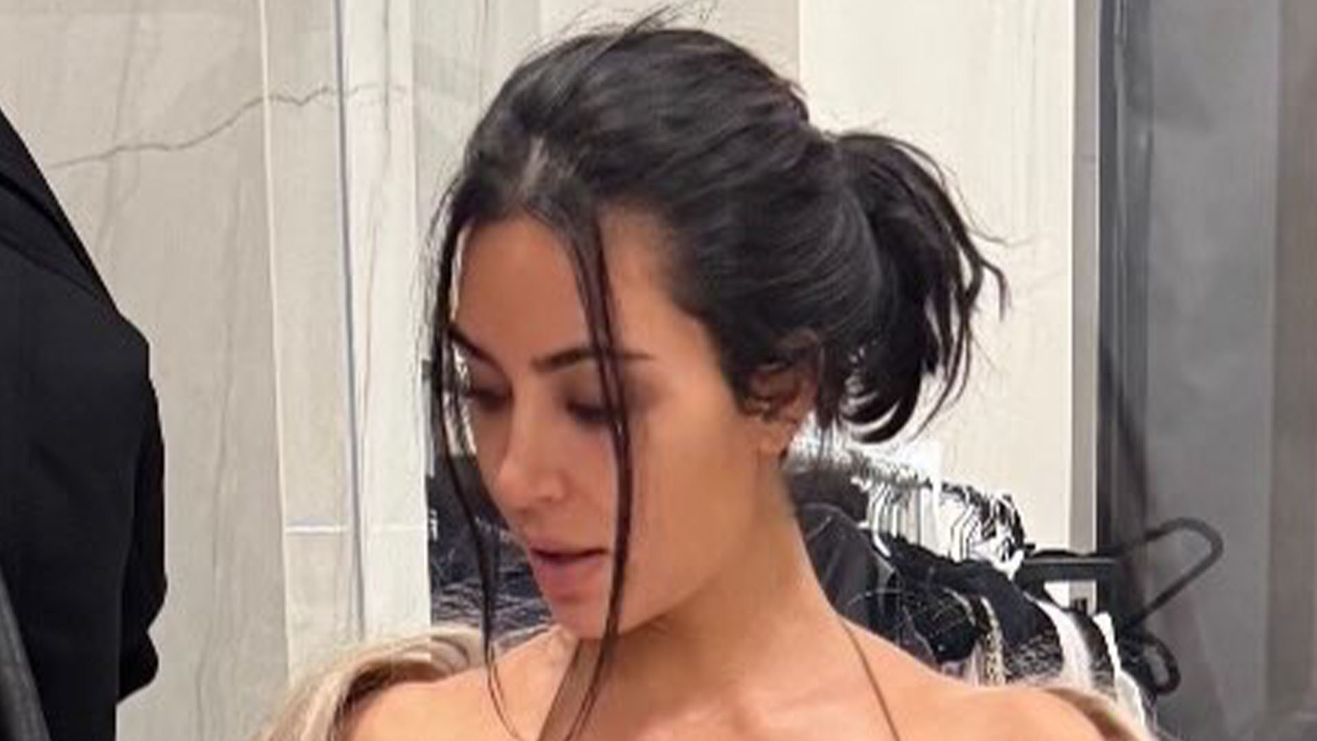 Kim Kardashian ditches her underwear in VERY low-cut backless dress and uses just a black bar to cover her nipples