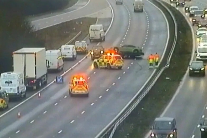 M1 closed after car flips in major crash as emergency crews flood scene and commuters hit with long delays