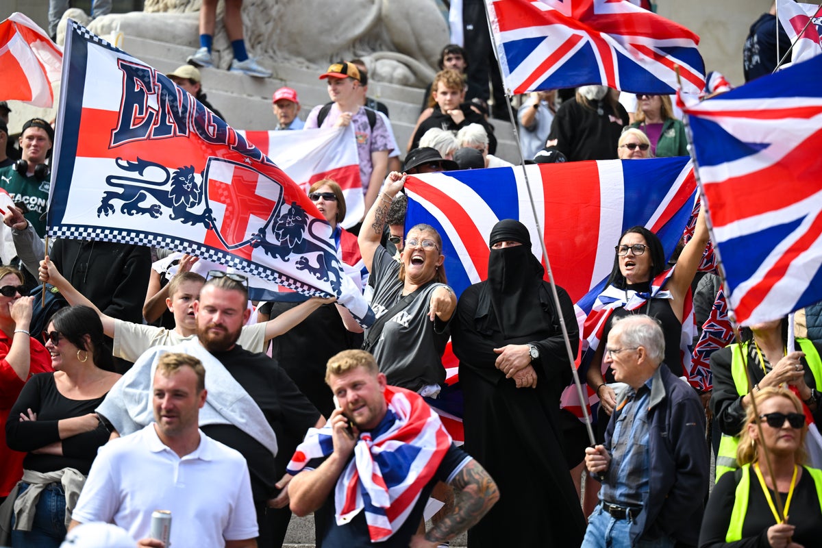 Man charged after wearing burkha to anti-migrant protest amid balaclava ban