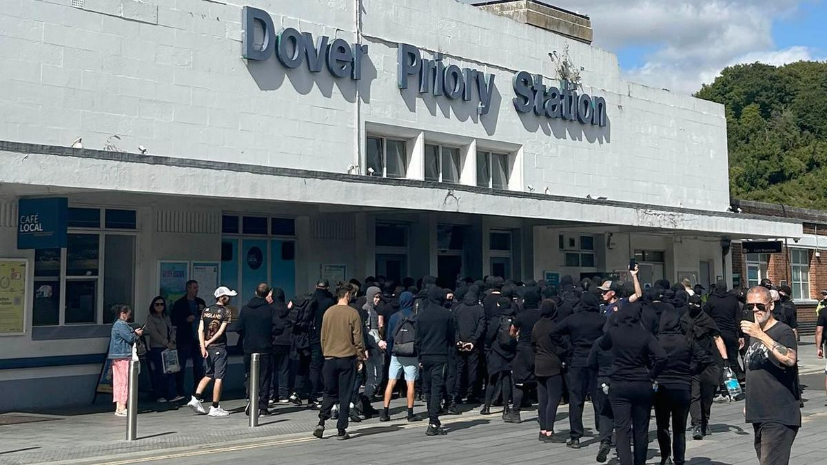 Masked men block roads in UK port 'stop the boats' demo