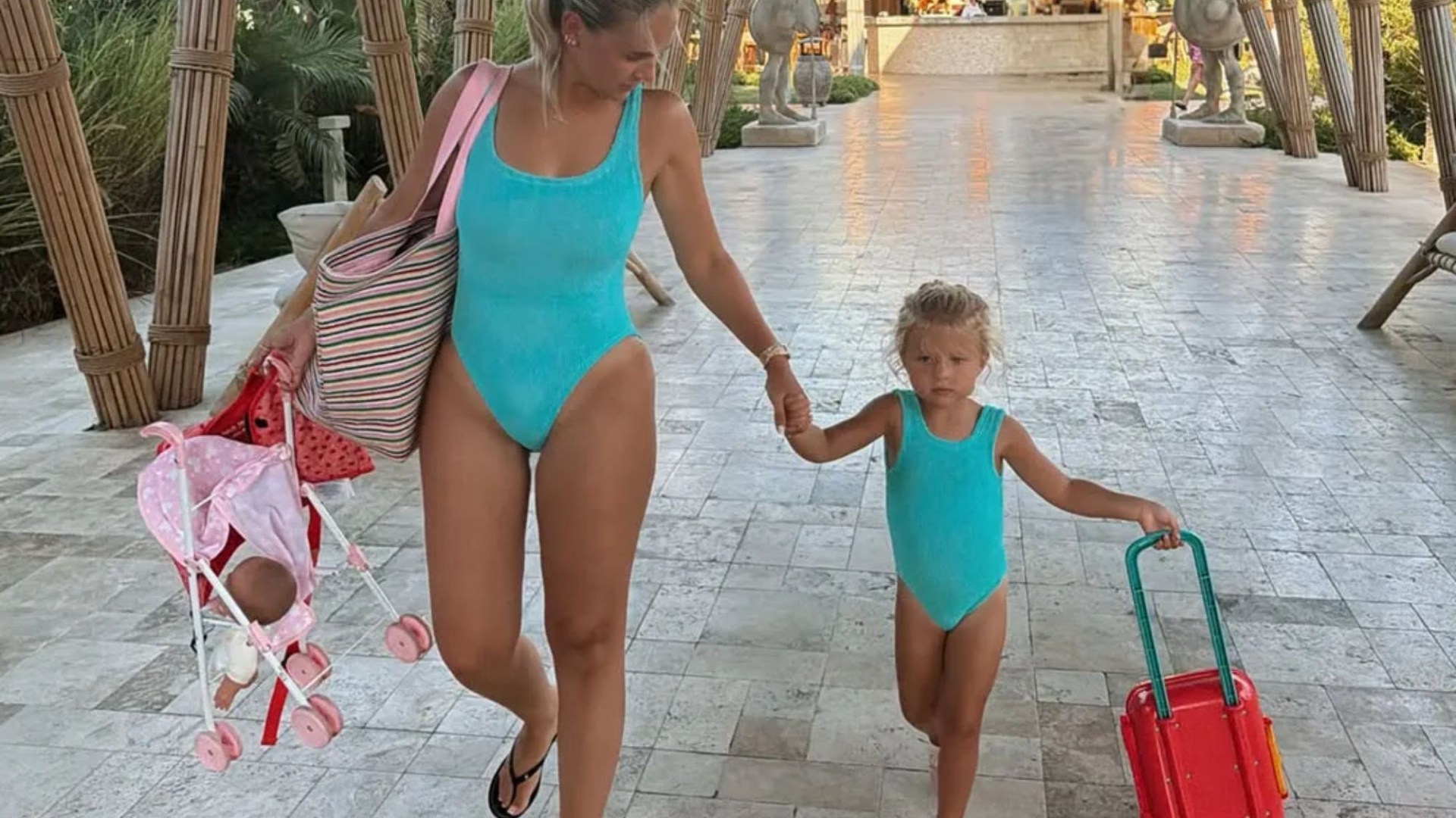 Molly-Mae shows off incredible figure in matching blue swimsuit with daughter Bambi – three months after giving birth