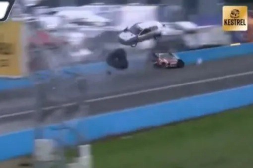 Moment car flies over circuit barrier after 170mph crash with rival in drag racing championship – as ‘three injured’