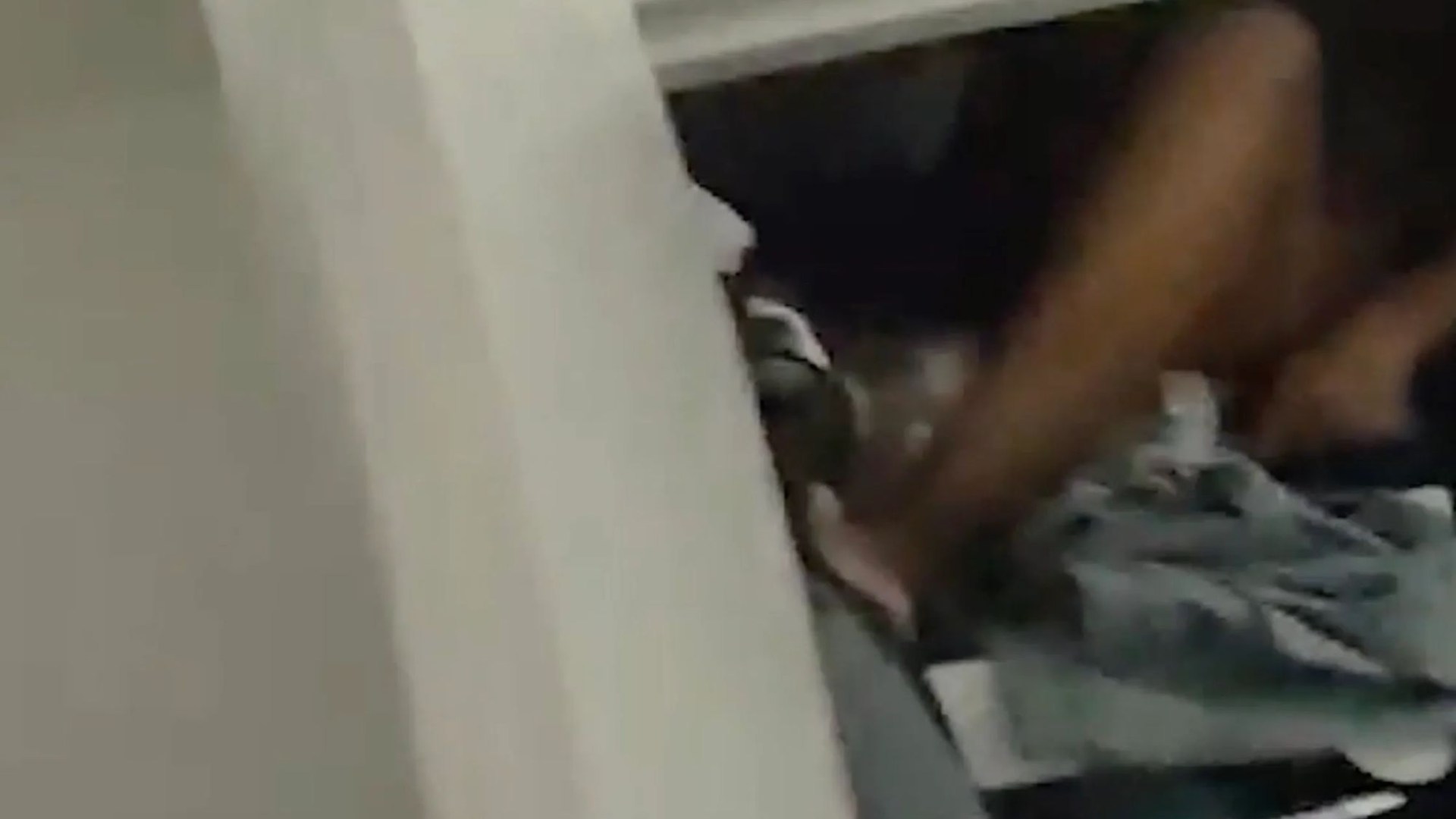 Moment half-naked drug dealer is caught hiding in wardrobe & arrested after exposing location on public Wi-Fi