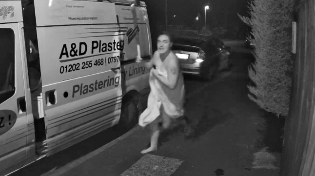 Moment woman wearing only bath towel armed with baseball bat chases off car thief