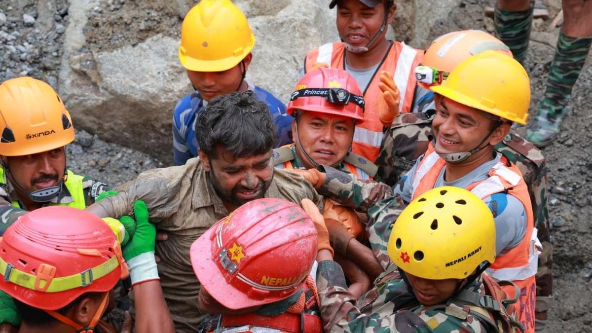 Muddy but alive: two workers rescued from Nepal tunnel