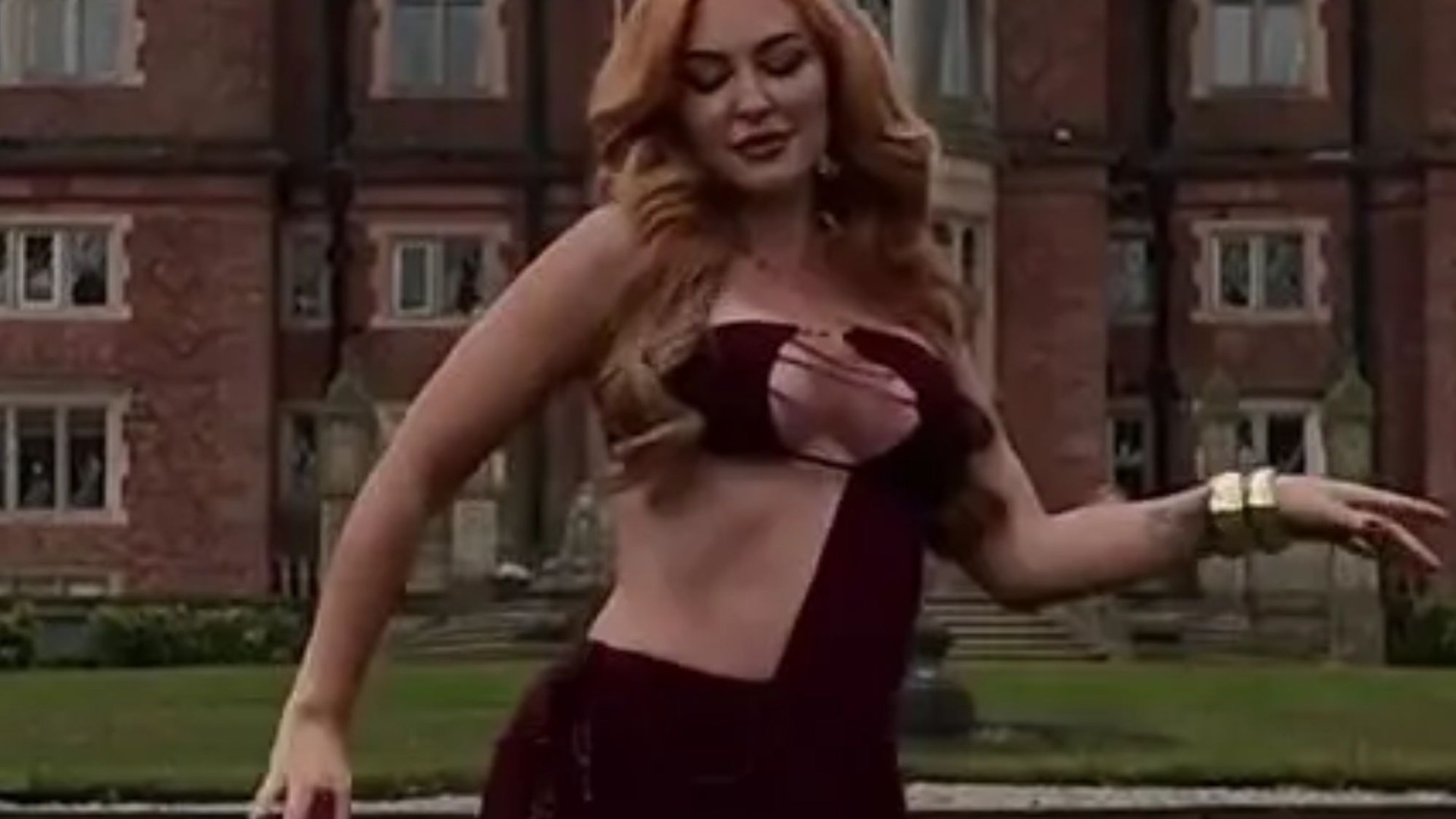 Natasha Hamilton hits back at trolls as her cut away dress clings on to her curves for dear life