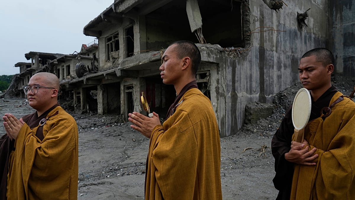 Nepal holds a day of mourning and rescue efforts continue after flash floods kill 1,300