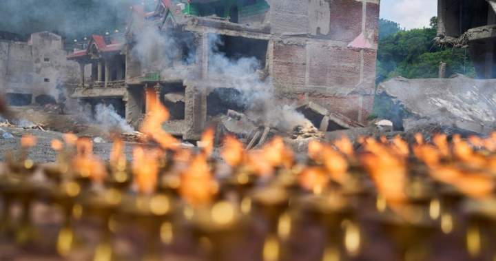Nepal holds day of mourning after deadly floods kill at least 1,300