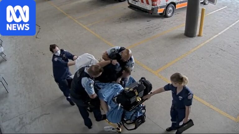Officer who hit man on hospital stretcher keeps job with NSW Police