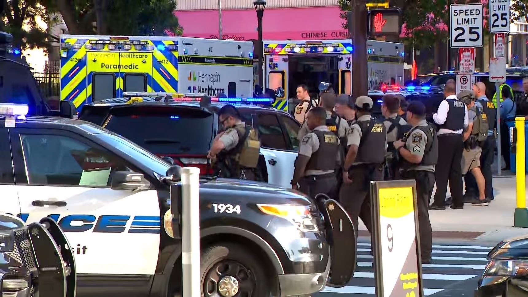 One killed and five injured including 2 cops after shooter opened fire as FBI rush to block of flats