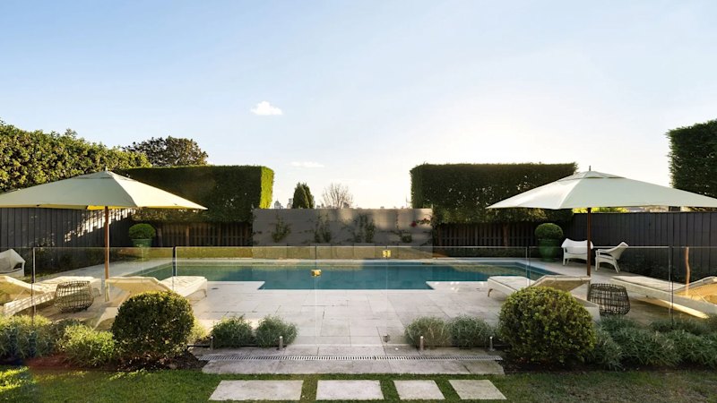 Retail boss lists $17m ‘interim’ home as he moves into Swans chairman’s $40m abode