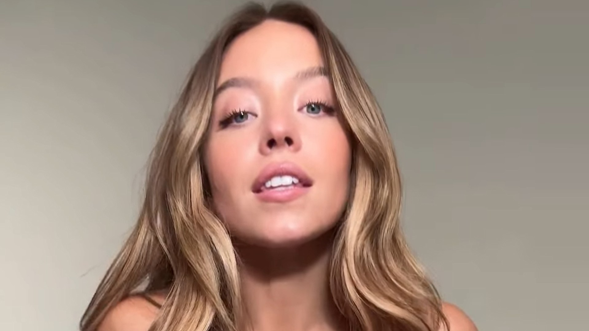 Sydney Sweeney bounces in a little white bralette and underwear as she launches latest Syrn campaign