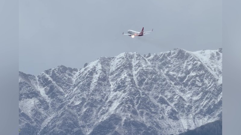 Sydney-bound Qantas flight diverted after flames appear spitting from engine