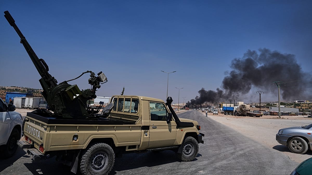Temporary wartime weapons depot explosion kills 14 outside Syria's Idlib