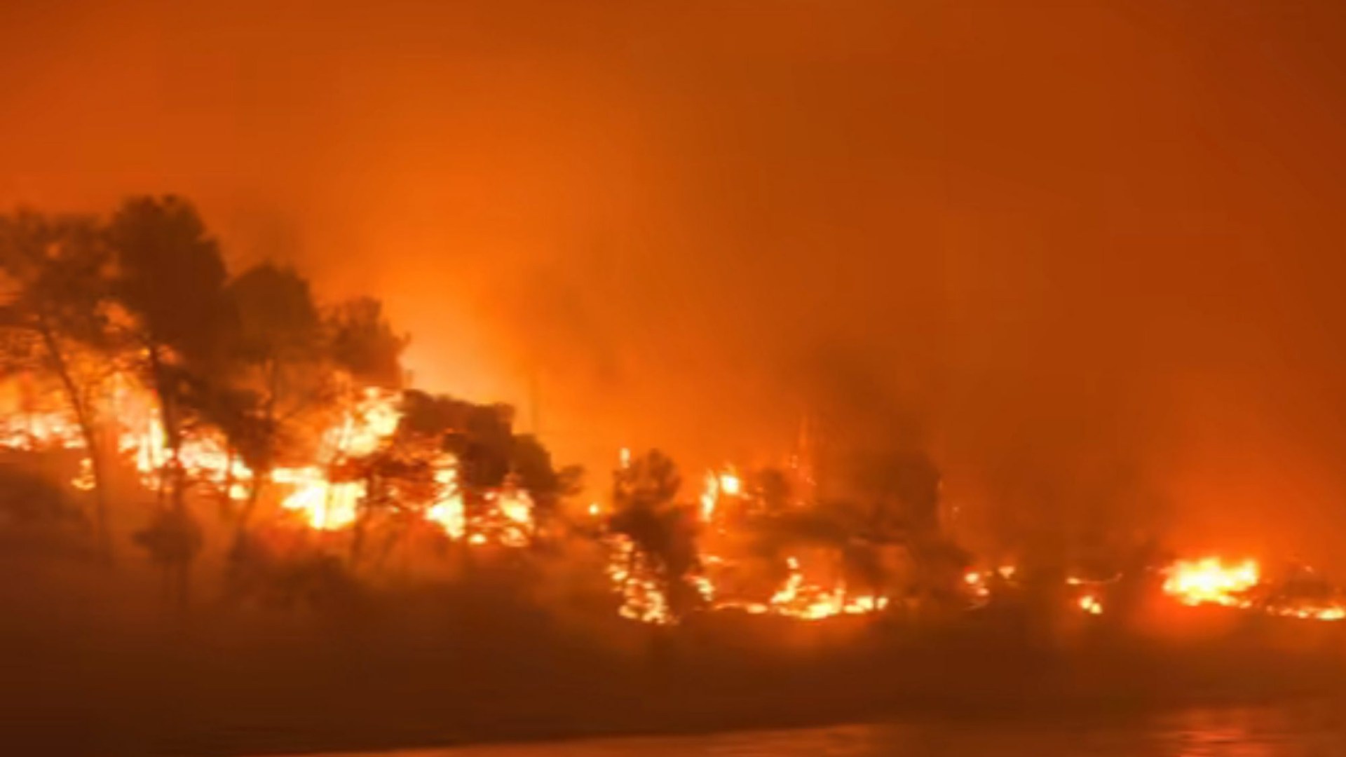 Terrifying moment Brit tourists flee wildfires on little boats in Dunkirk-style evacuation from holiday island inferno