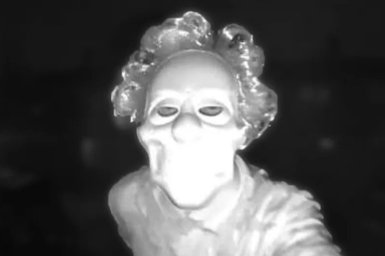 Terrifying moment axe-wielding clown turns up at mum-of-three’s house ‘growling’ before slamming weapon into door