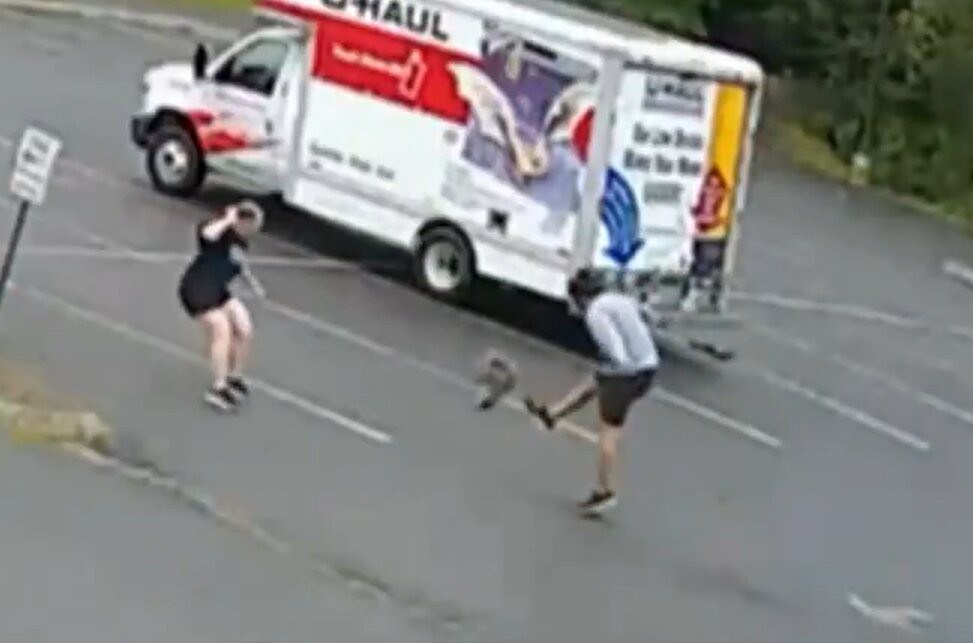 Terrifying moment mystery animal launches vicious attack on two people at parking lot – but no one knows what it is
