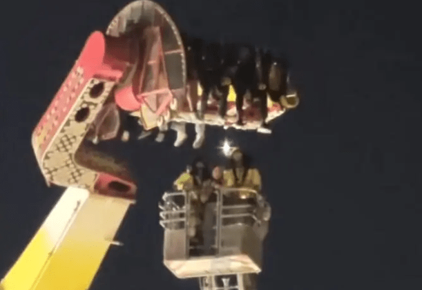 Thrill seekers spend FOUR hours dangling 100ft in air after pendulum ride malfunctions at fairground