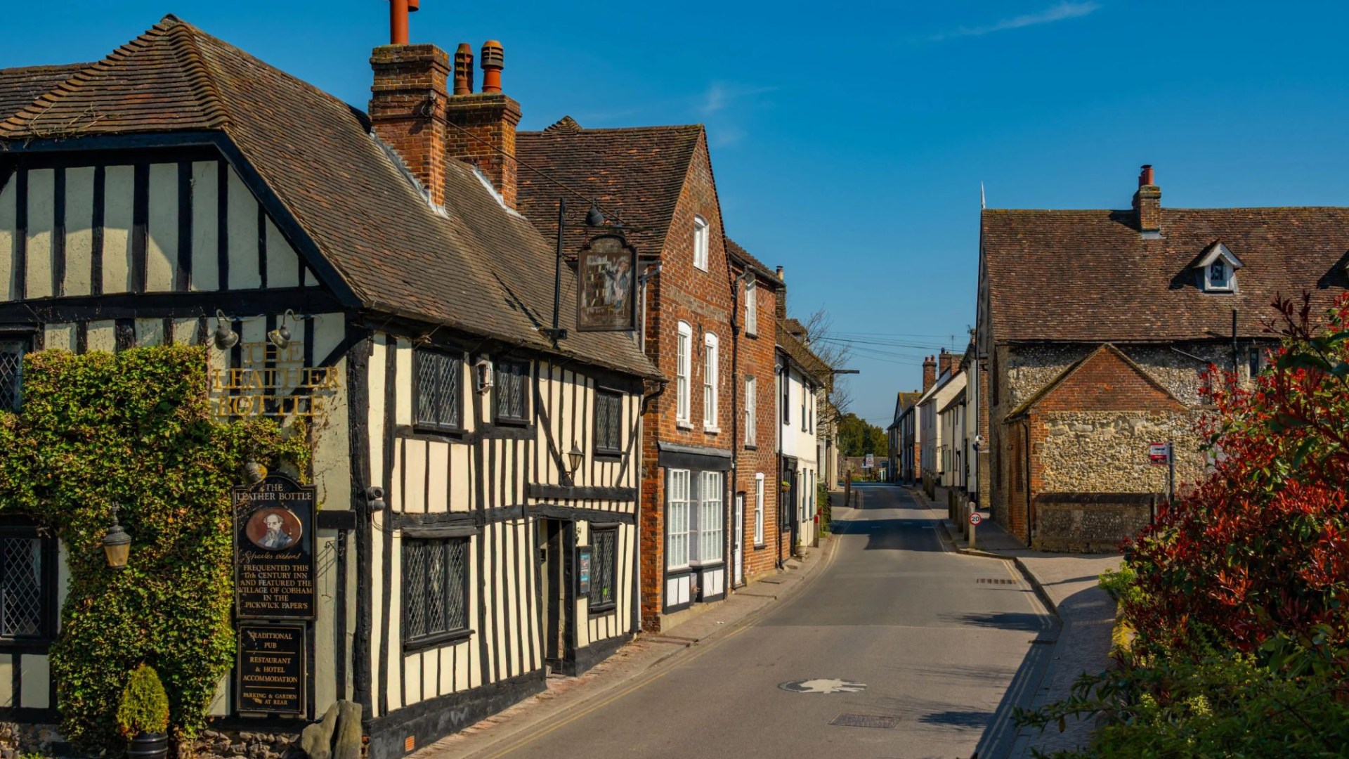Two cyclists killed and another injured after car crashes into riders in UK village – as three arrested