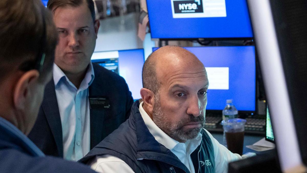 Wall St slips as AI slowdown fears hammer chip firms