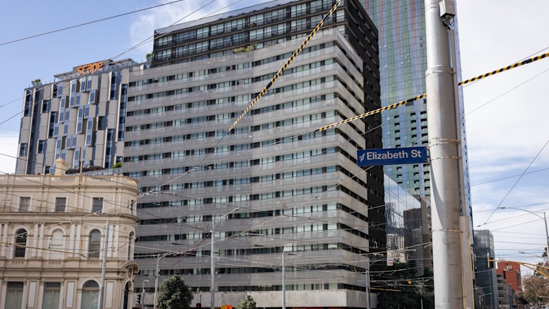 Warring strata companies leave Carlton apartment block with slow lifts, disgusting carpets, cracked windows
