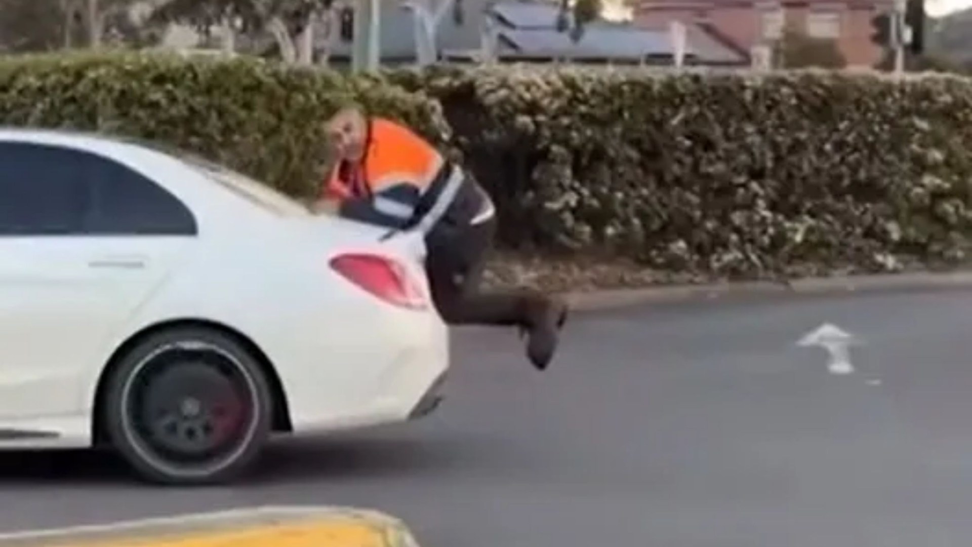 Wild moment car mechanic clings to Mercedes boot as driver reverses in row over ‘unpaid work worth thousands’